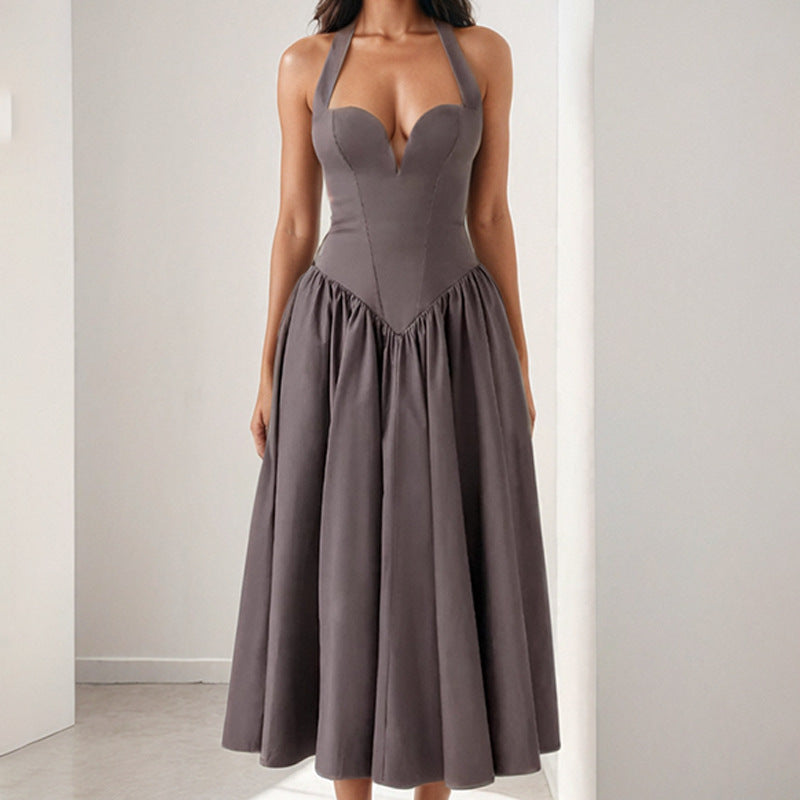 Halter neck backless maxi dress with a flared skirt